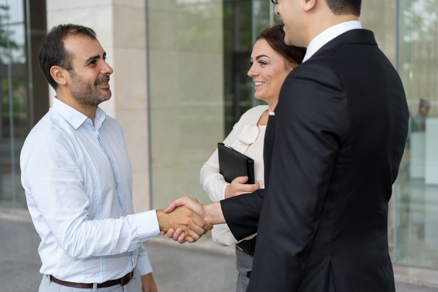 cheerful-entrepreneur-greeting-new-business-partner